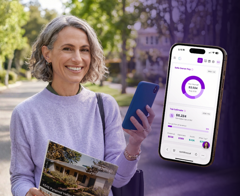 Real estate agent holding a phone showing her Cashflowy safe owner pay and tax estimate